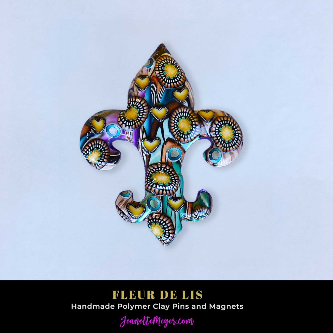 Handmade polymer clay fleur-de-lis pin by New Orleans artist Jeanette Meyer. A colorful, collectible design available as both pins and magnets.