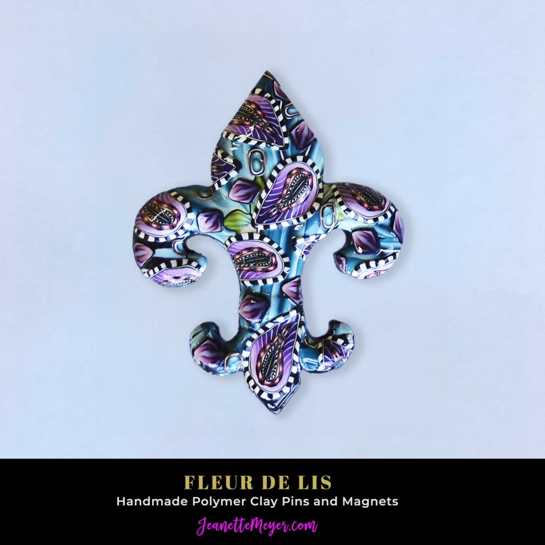 Handmade polymer clay fleur-de-lis pin by New Orleans artist Jeanette Meyer. A colorful, collectible design available as both pins and magnets.