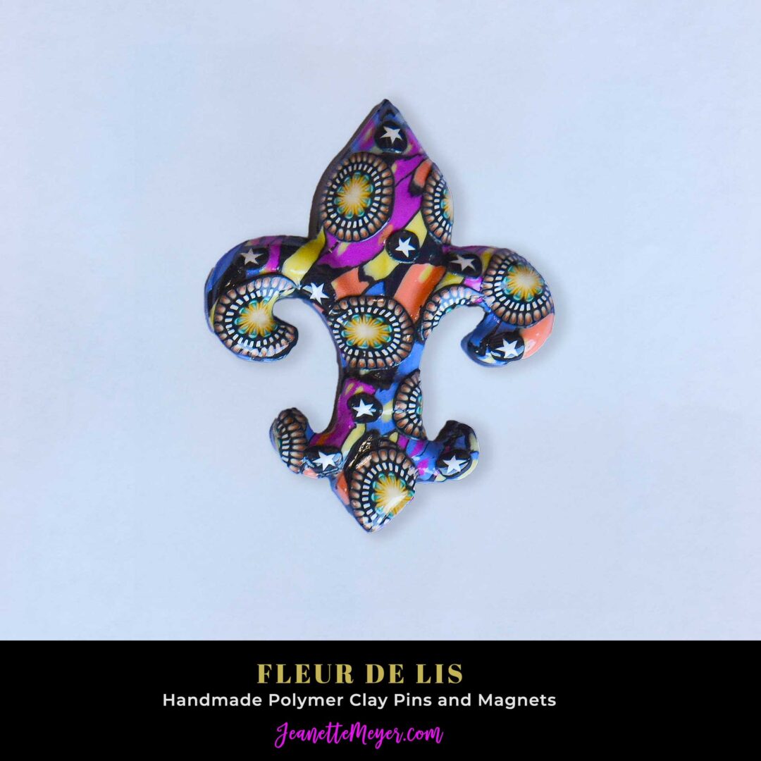 Handmade polymer clay fleur-de-lis pin by New Orleans artist Jeanette Meyer. A colorful, collectible design available as both pins and magnets.
