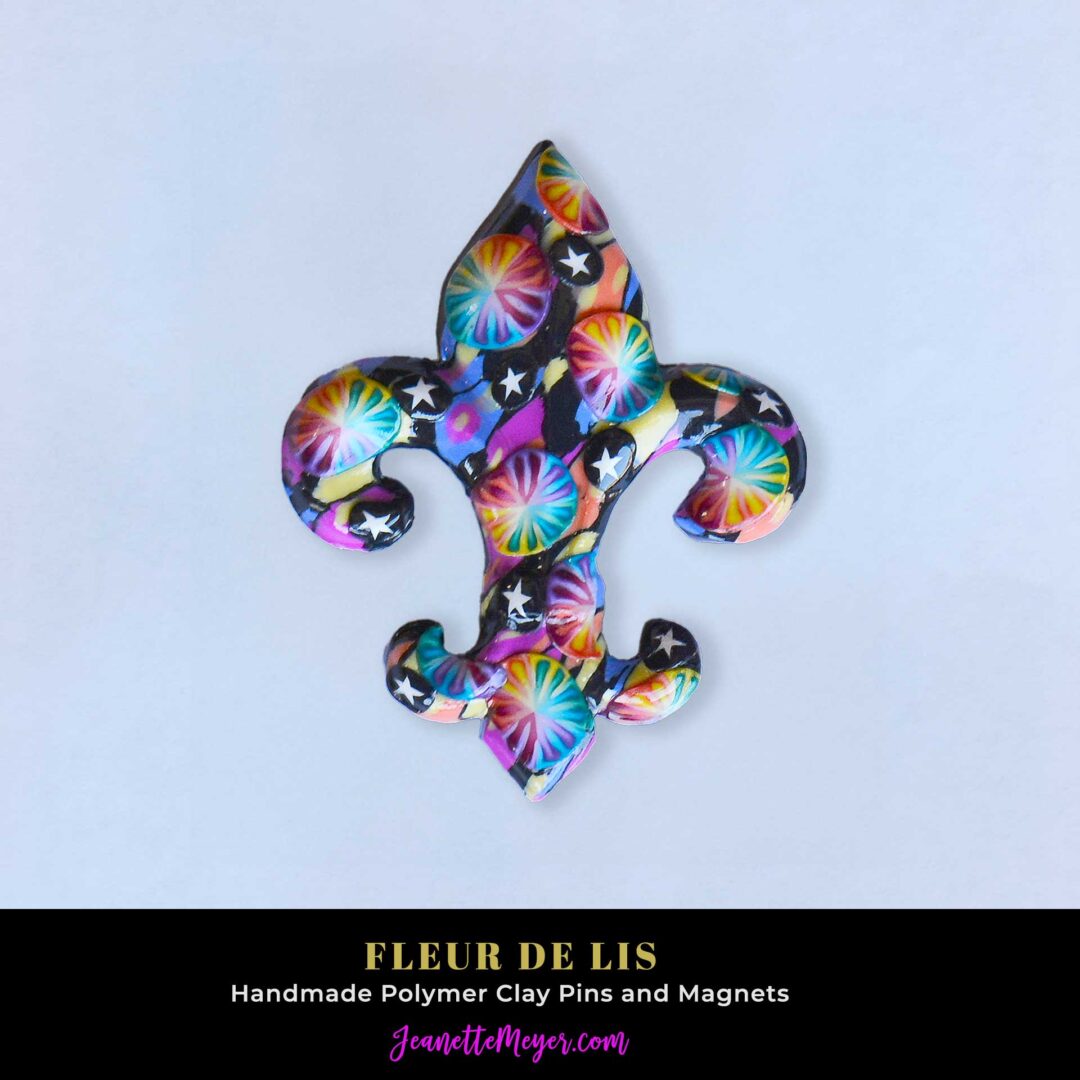 Handmade polymer clay fleur-de-lis pin by New Orleans artist Jeanette Meyer. A colorful, collectible design available as both pins and magnets.