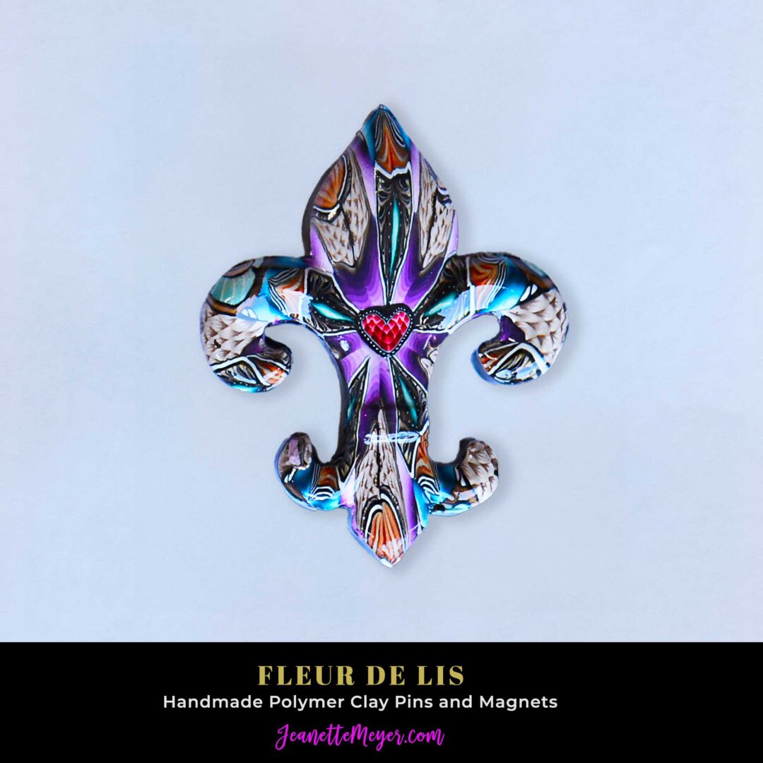 Handmade polymer clay fleur-de-lis pin by New Orleans artist Jeanette Meyer. A colorful, collectible design available as both pins and magnets.