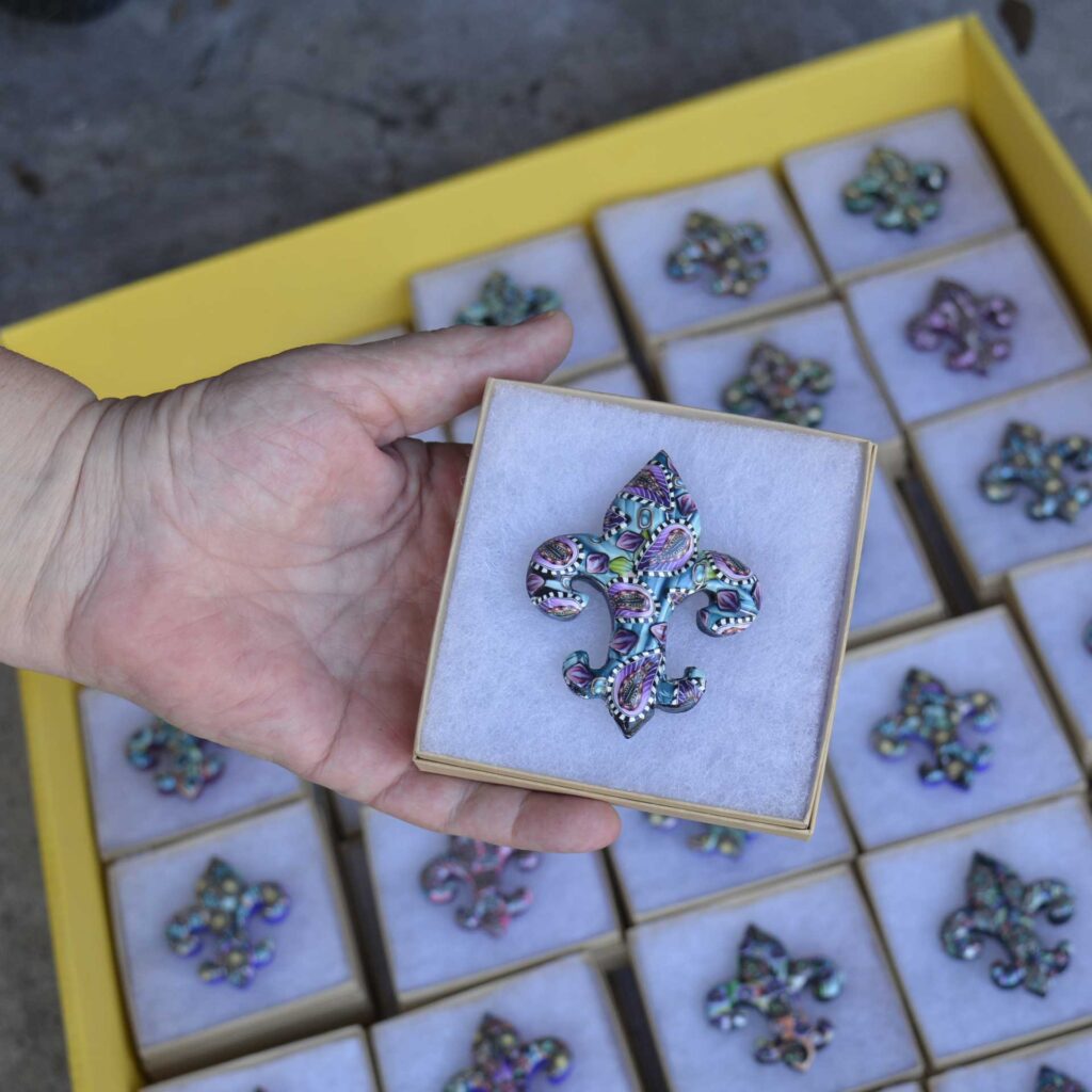 Handmade polymer clay fleur-de-lis pin by New Orleans artist Jeanette Meyer. A colorful, collectible design available as both pins and magnets.