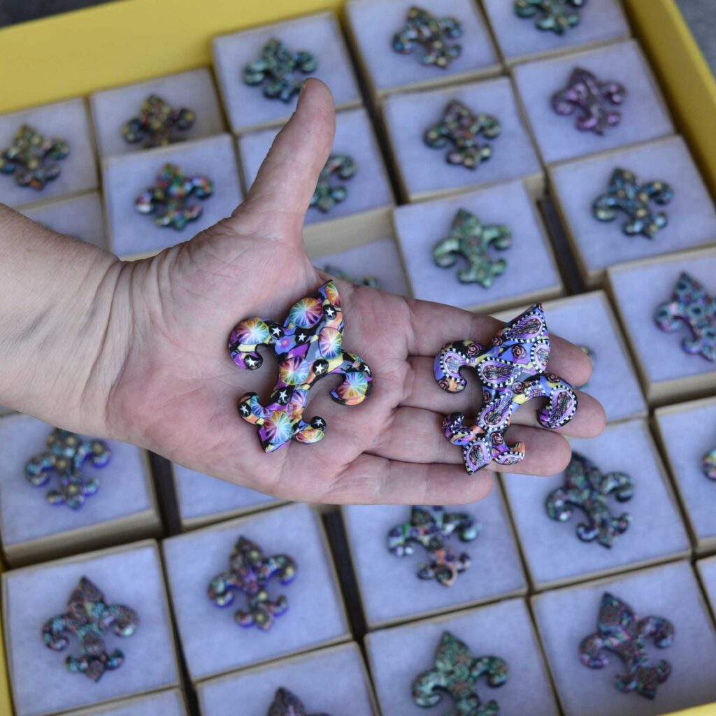 Handmade polymer clay fleur-de-lis pin by New Orleans artist Jeanette Meyer. A colorful, collectible design available as both pins and magnets.